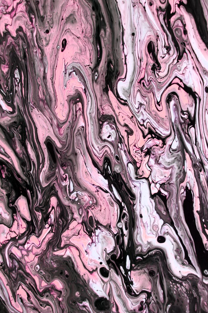 Captivating pink and black fluid art with swirling patterns, perfect for modern decor.