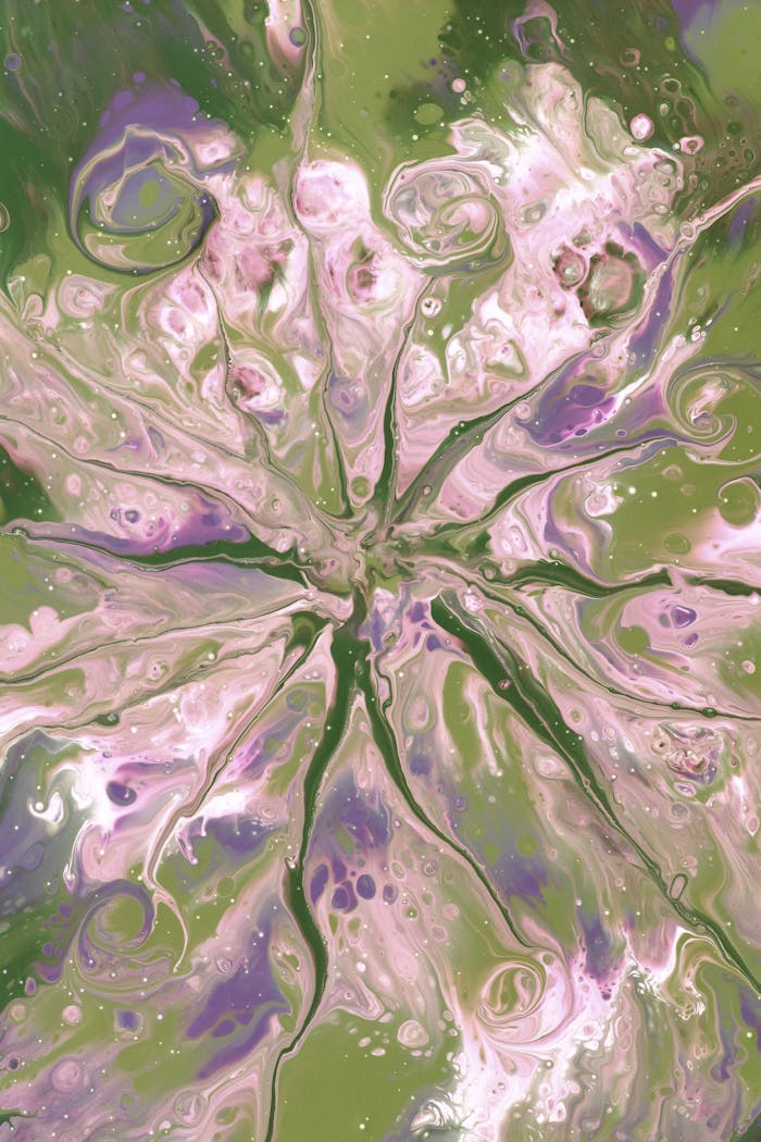 Vibrant abstract fluid art in shades of green and pink, creating a mesmerizing pattern.