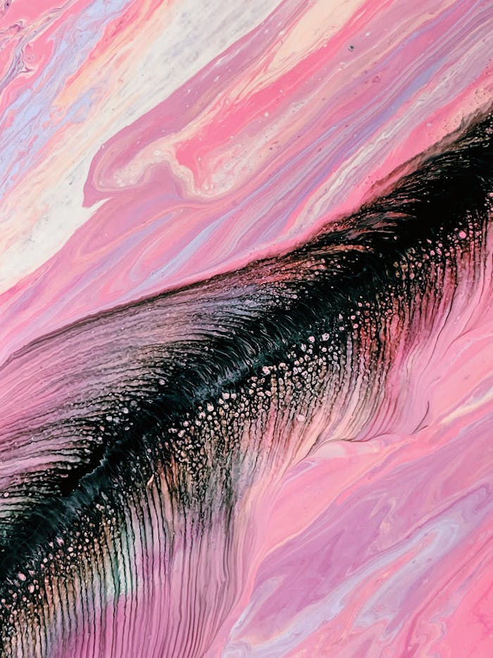Vibrant abstract painting with pink and black marble textures, showcasing creative expression.