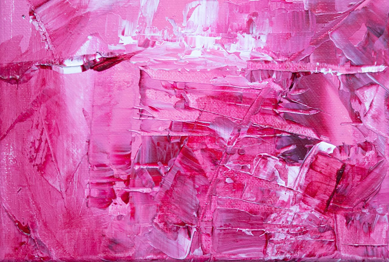 Expressive abstract painting in pink hues, featuring textured brush strokes on canvas.